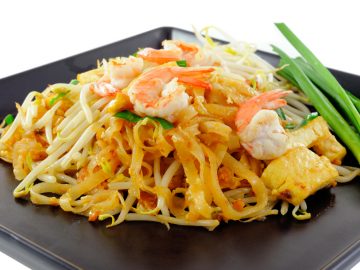Thai food Pad thai , Stir fry noodles with shrimp on black plate