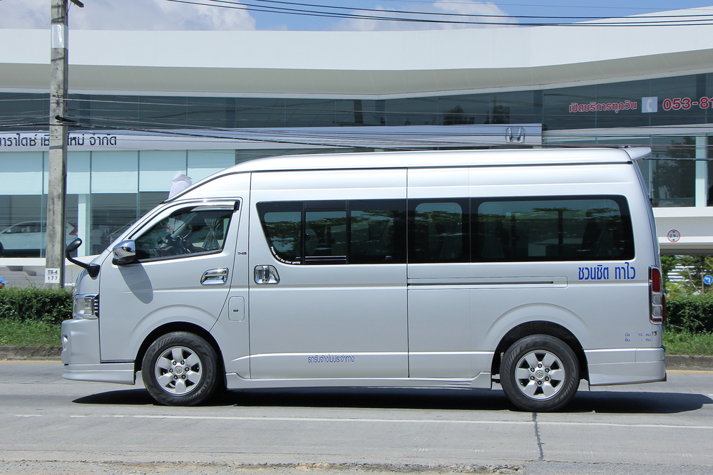 CHIANGMAI, THAILAND -SEPTEMBER  22 2015:  Private Toyota commuter van for rent to Travel. Photo at road no.1001 about 8 km from downtown Chiangmai, thailand.