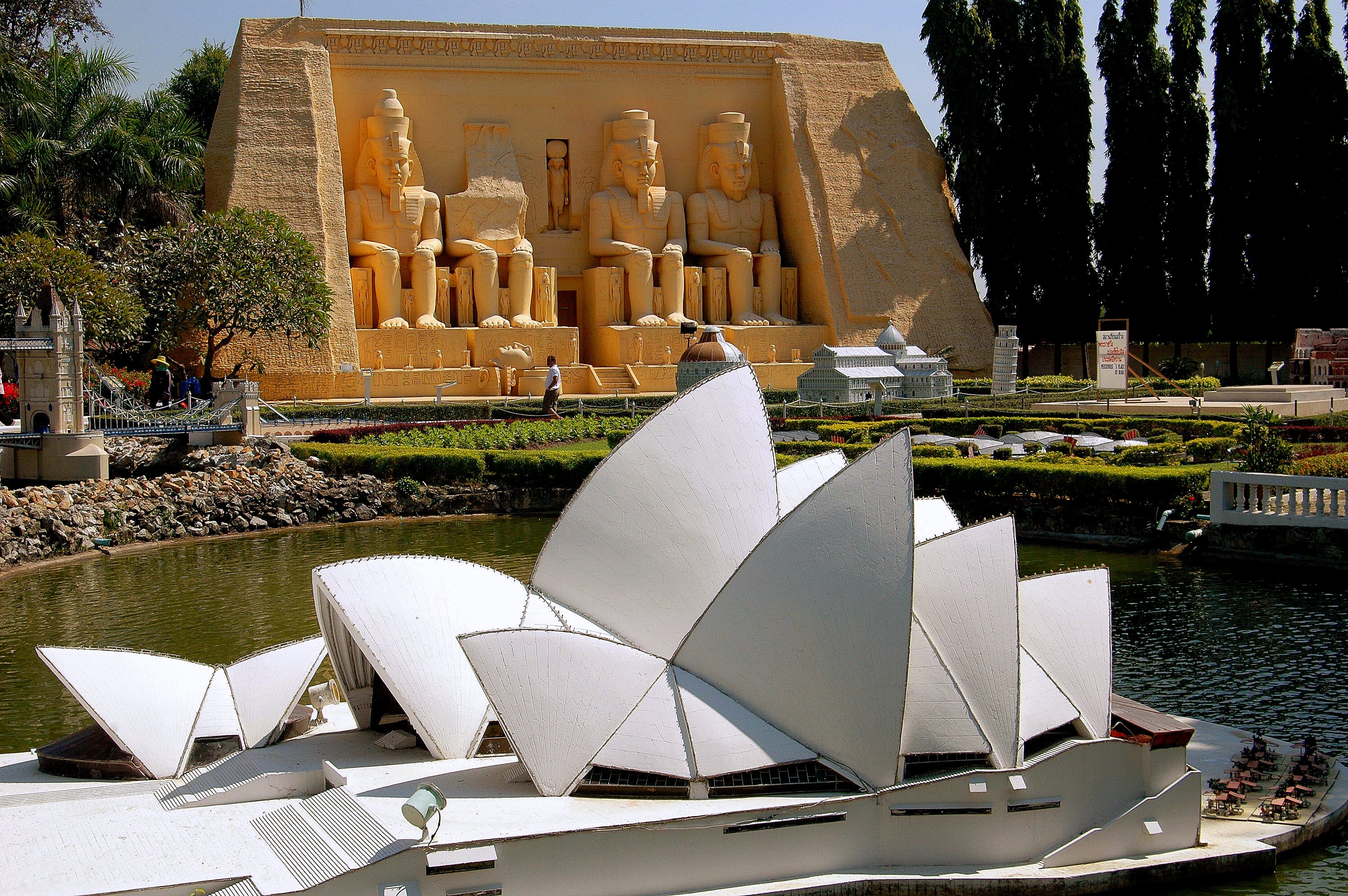 Pattaya, Thailand - December 30, 2005:  The Sydney, Austrailia Opera House and Egypt's Abu Simbel with four statues of Ramses II at Mini Siam outdoor theme park